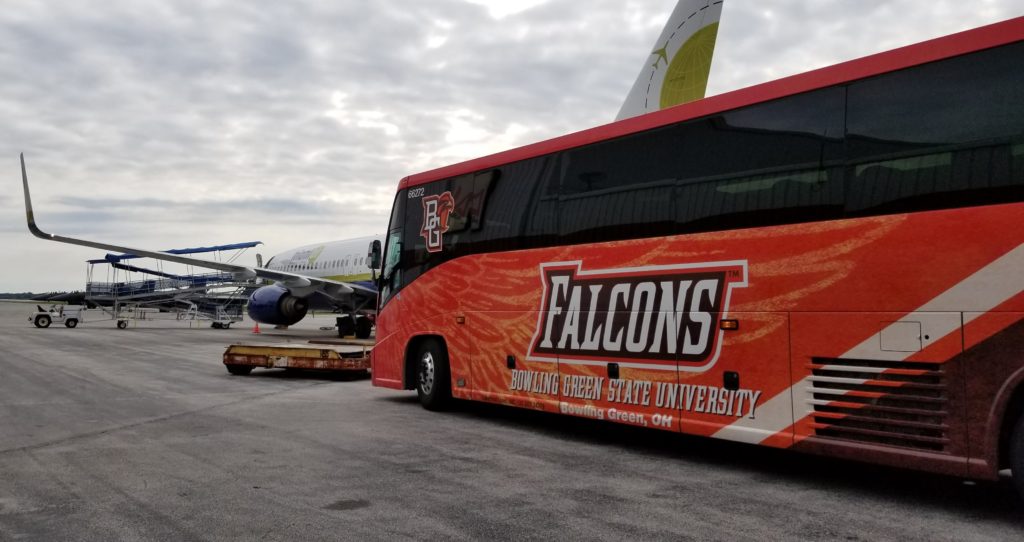 BGSU bus carrying their football team arrives at Grand Aire