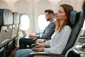 Passenger on airplane comfortably reclined