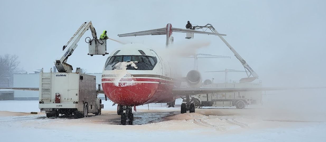 Plane being sprayed with deicing fluid