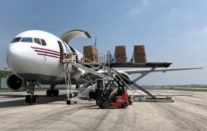 Air freight being loaded onto a cargo plane via K-loader