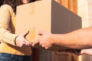 Last Mile Carrier handing package to customer