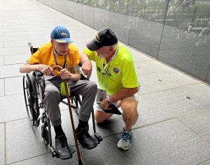 Member of Flag City Honor Flight Mission #19 and his Guardian