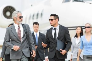 Business professionals deplaning a private charter flight