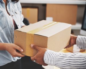 Package being hand delivered to recipient