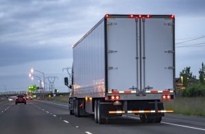 Semi truck on highway at night