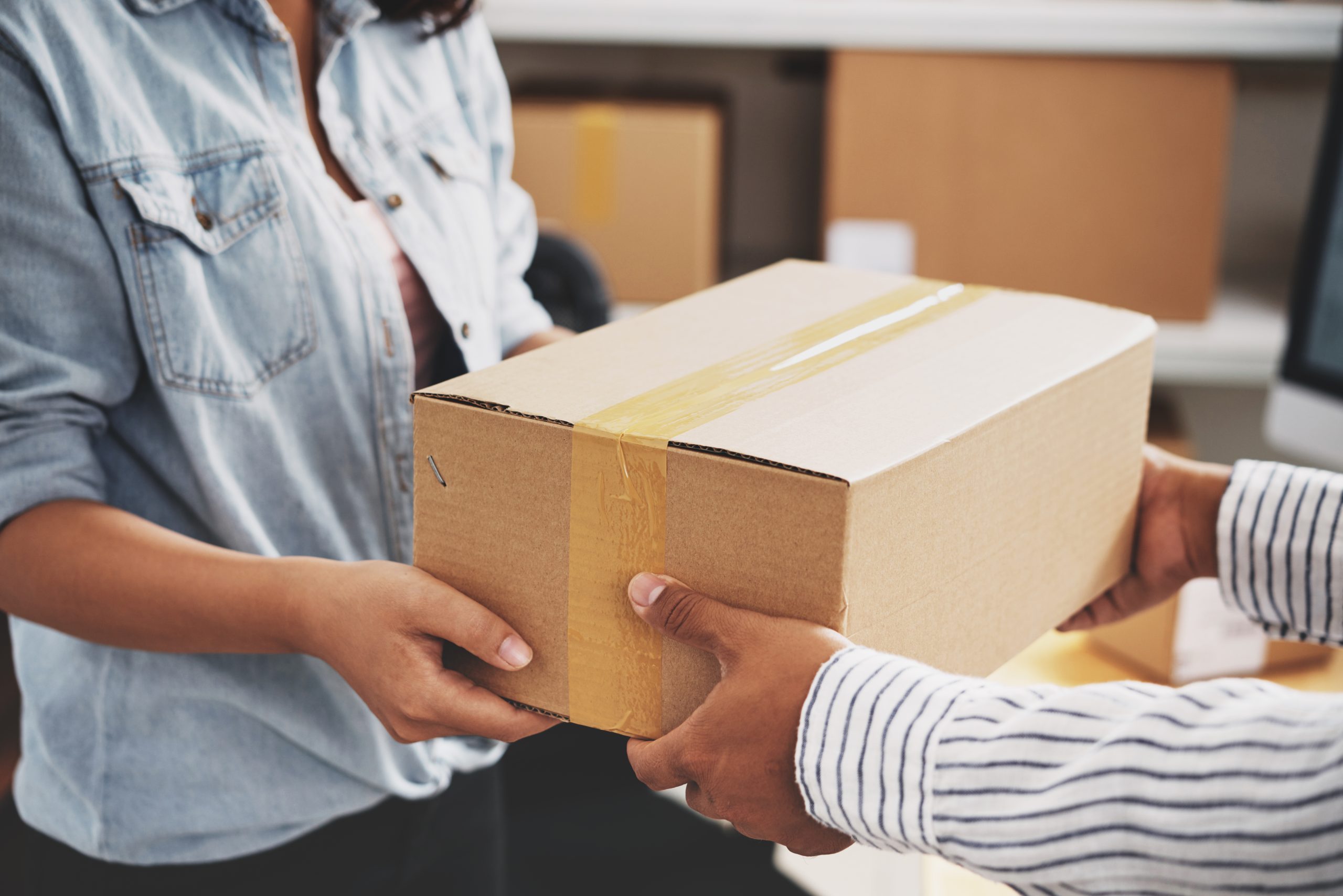 Package being hand delivered to recipient