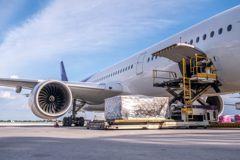 Cargo being loaded into the belly of a commercial aircraft