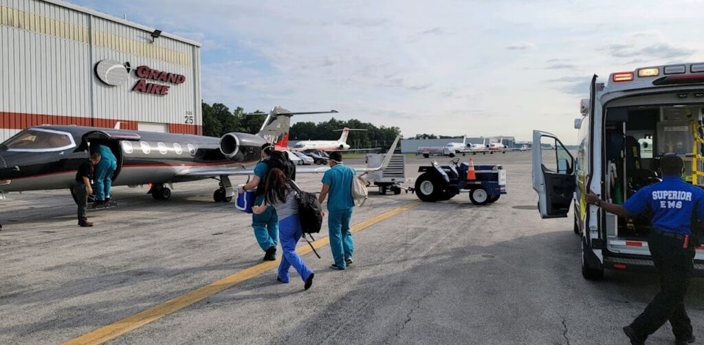 Medical team boarding airplane to transport donated organ to recipient