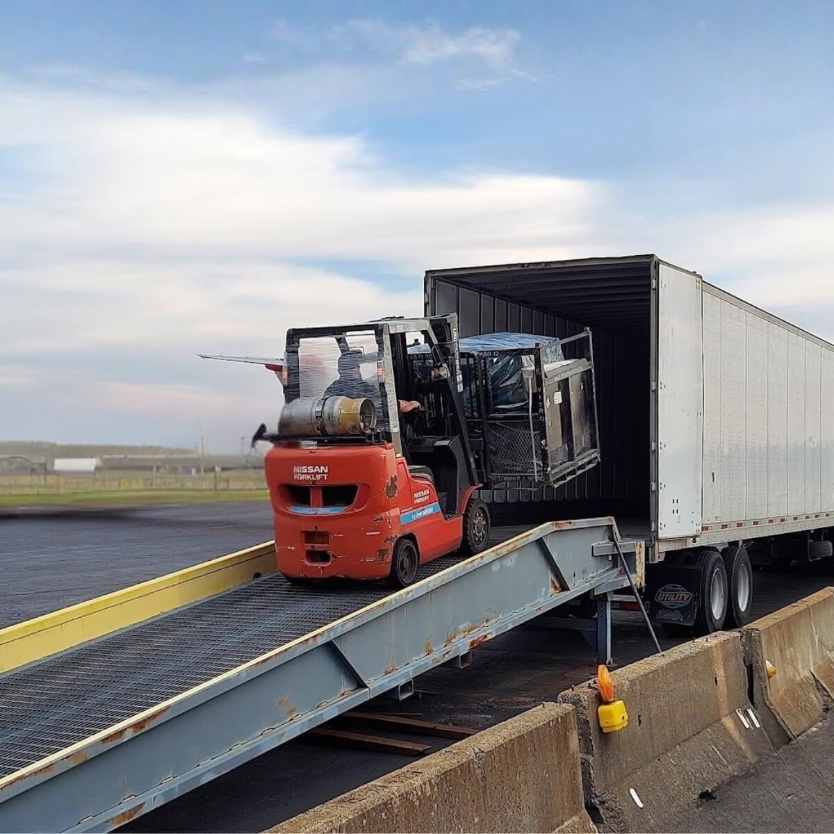 forklift loading a truck