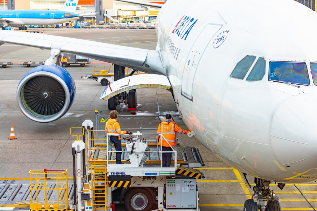 Freight being loaded onto a Delta commercial airplane